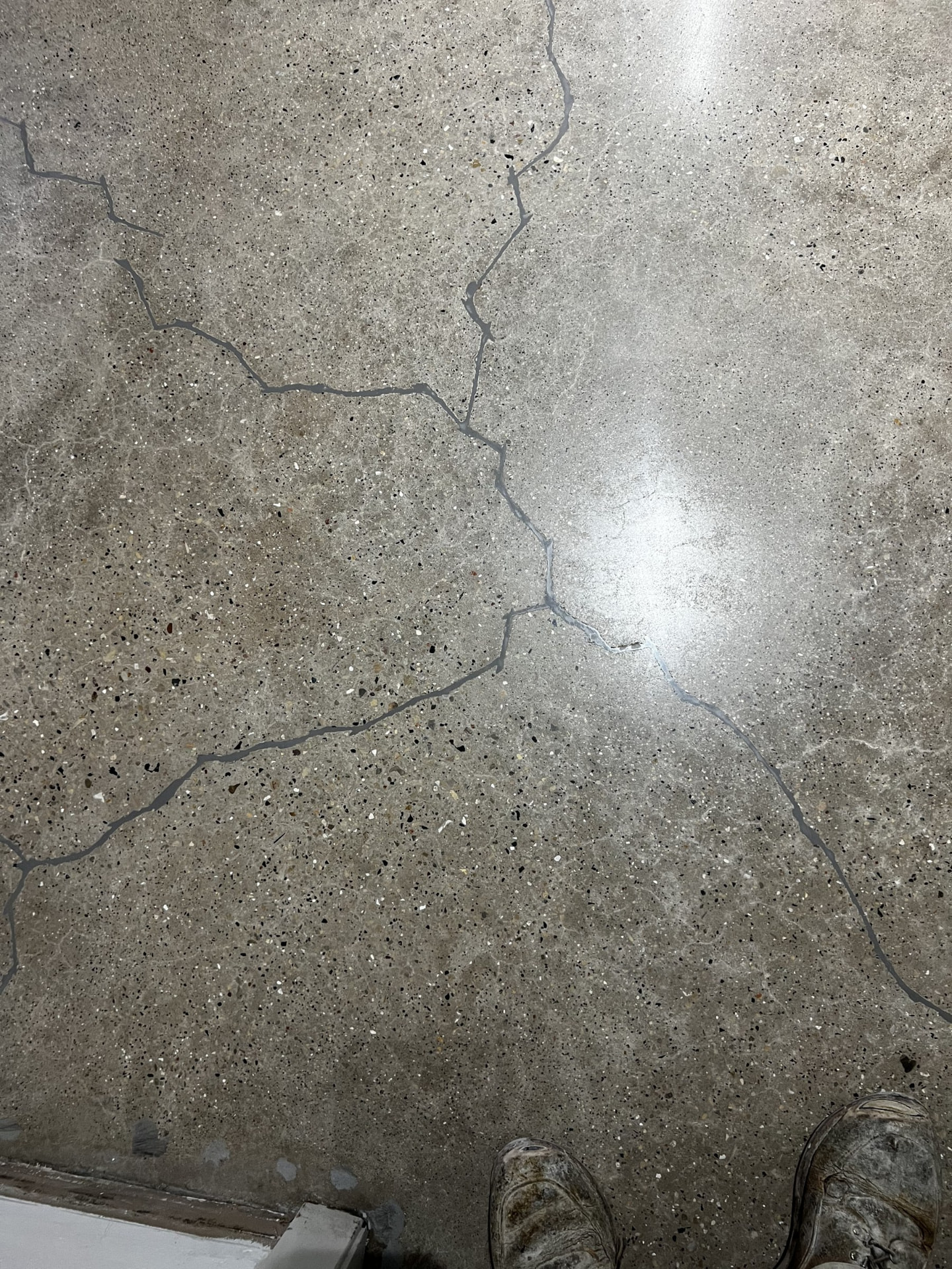 Repaired cracks in a polished concrete floor in Wisconsin